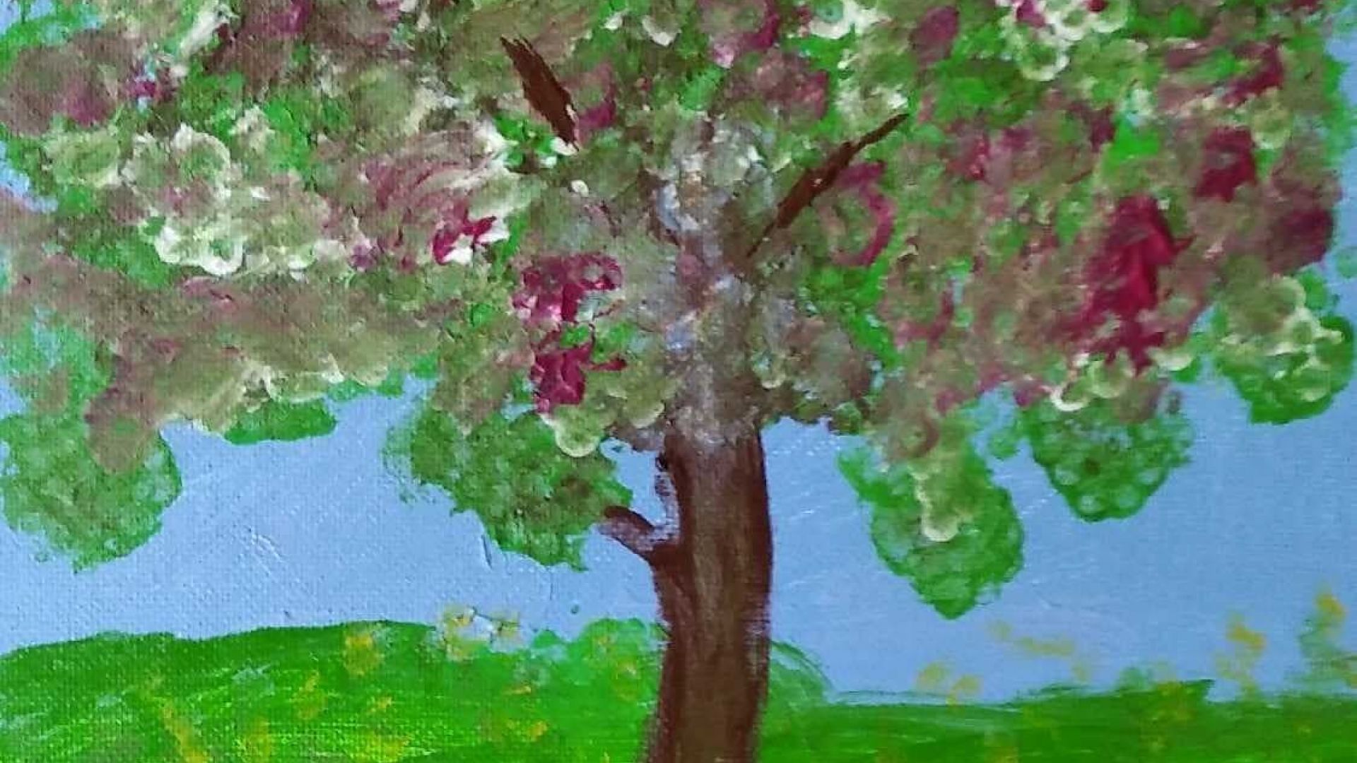 Obraz kwitnącego drzewa, z żółtymi kwiatami na zielonej łące i niebieskim tłem wykonany farbami. Autor: Tadeusz A.